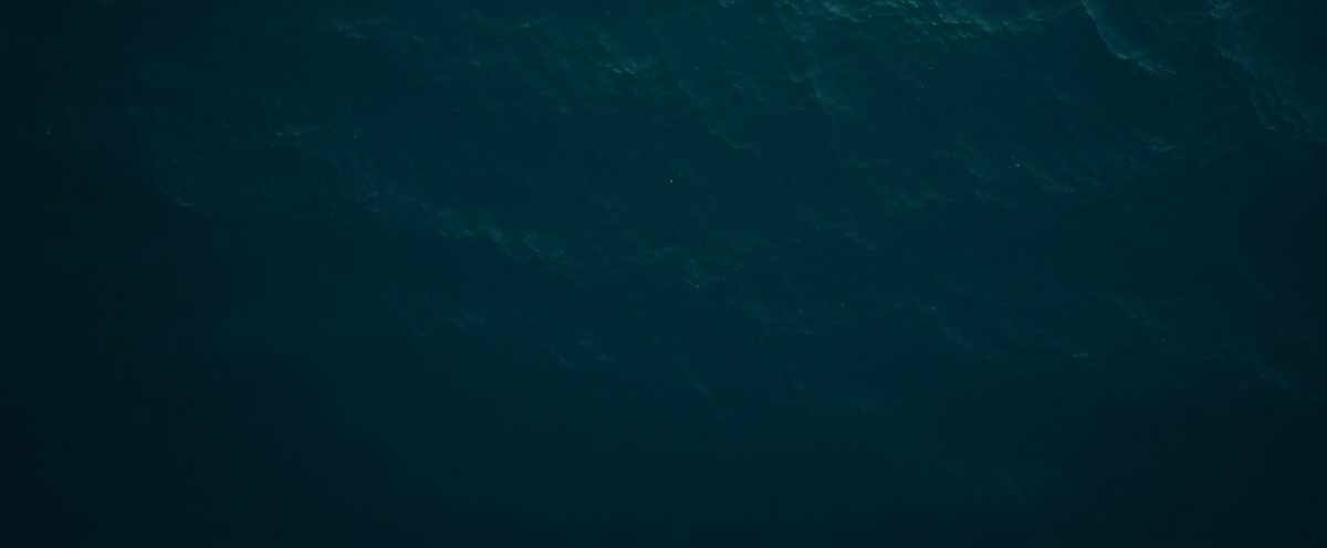 Ocean swell lines from above, teal and dark